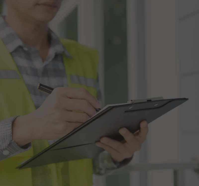 Worker writing on clipboard